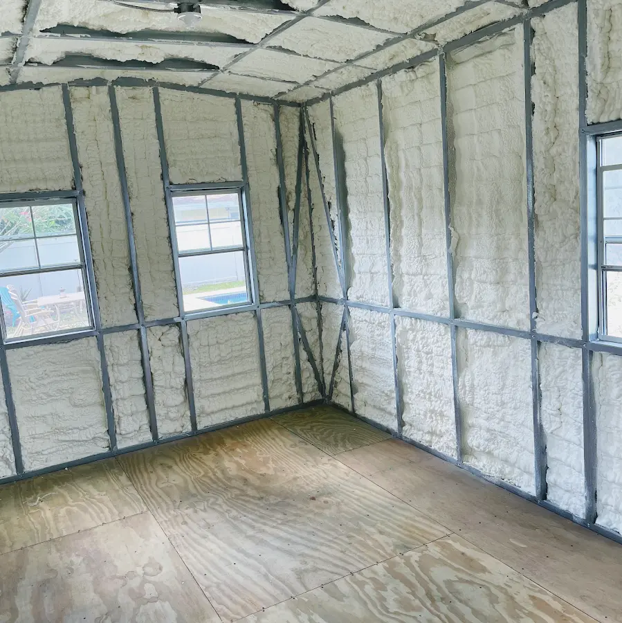 Closed-cell spray foam insulation applied to wall cavities in a residential project in Edison